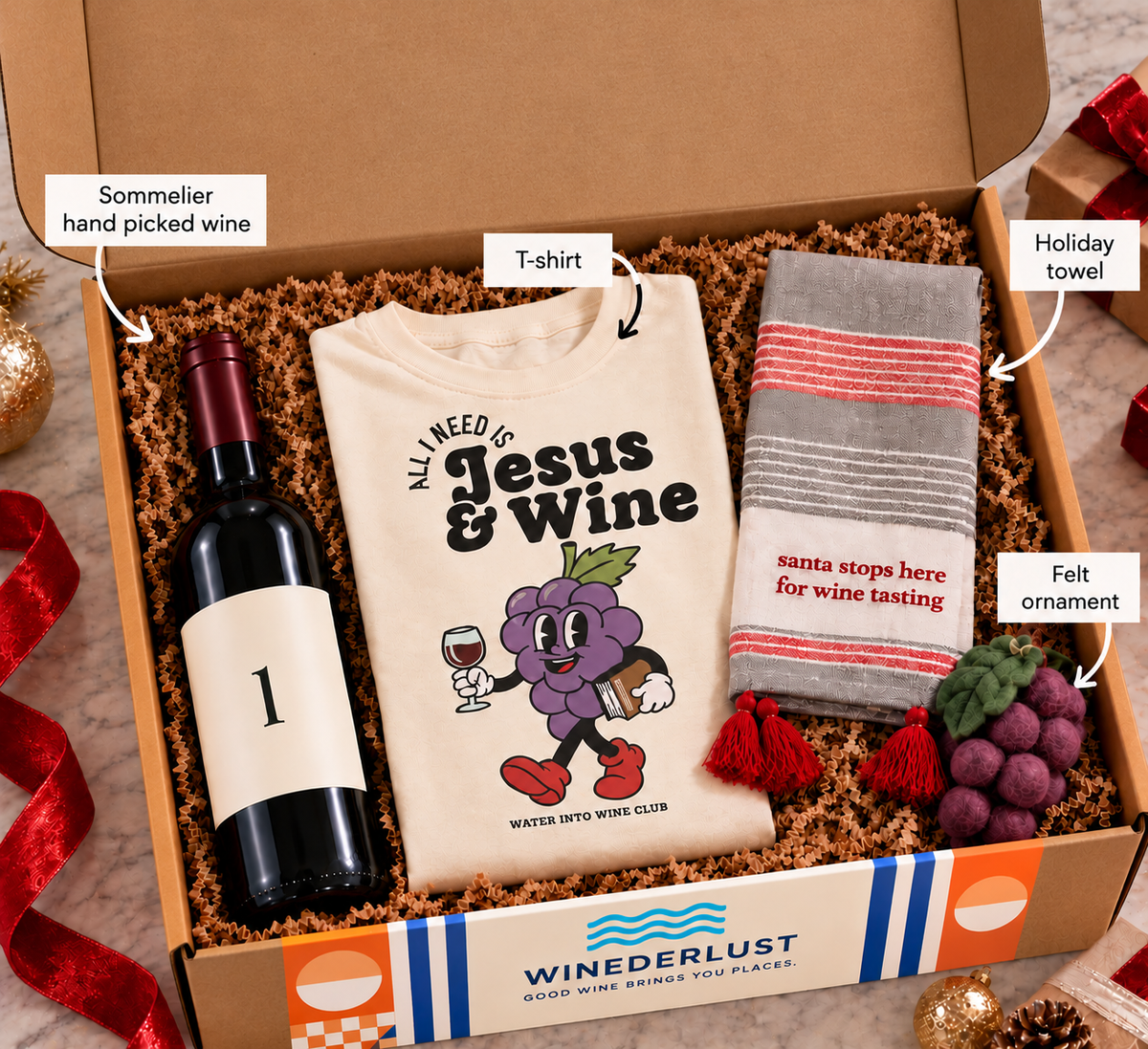 The Christmas Present gift box open with plain kraft lid, wine, t-shirt, towel and ornament